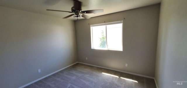 carpeted empty room featuring ceiling fan