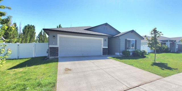 single story home with a garage and a front yard