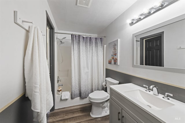 2908 E Iowa Ave, Nampa, ID 83686 - full bath featuring vanity, wood finished floors, toilet, and shower / bathtub combination with curtain