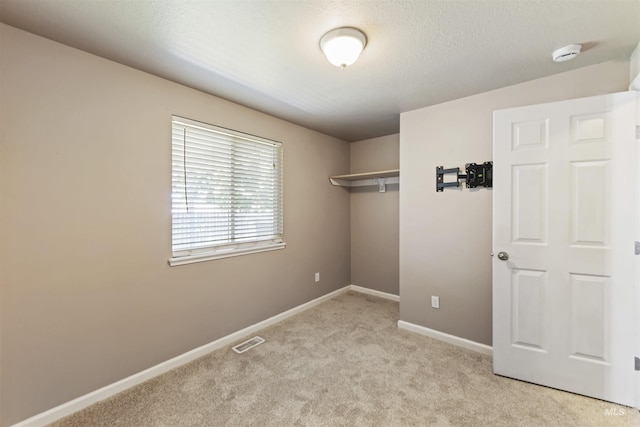2908 E Iowa Ave, Nampa, ID 83686 - unfurnished bedroom featuring light colored carpet, a closet, and baseboards