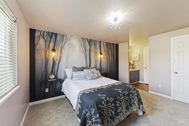 2908 E Iowa Ave, Nampa, ID 83686 - bedroom featuring carpet, baseboards, and connected bathroom