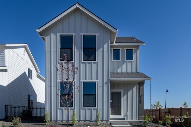 2804 N Eagle Meadow Ave, Kuna, ID 83634 - view of front facade with roof with shingles, board and batten siding, and fence