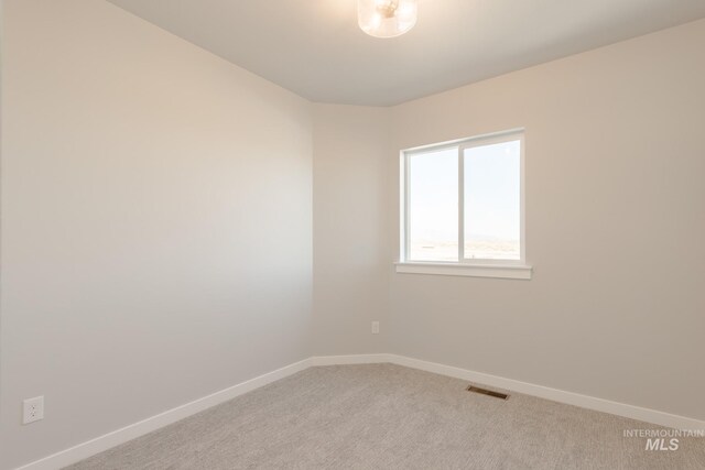 2804 N Eagle Meadow Ave, Kuna, ID 83634 - unfurnished room featuring light carpet, visible vents, and baseboards