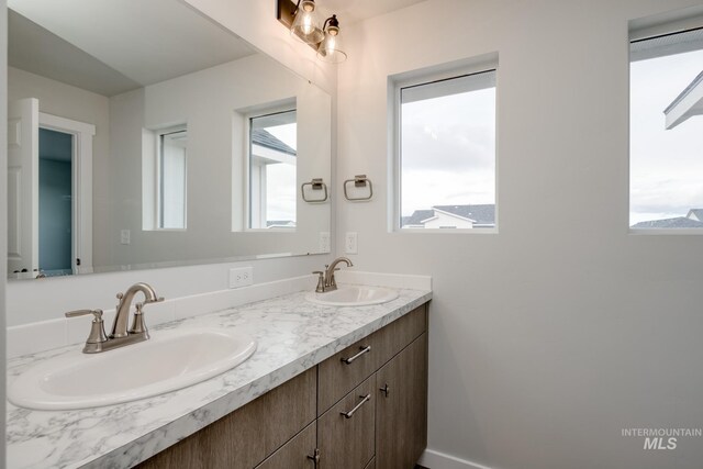 2804 N Eagle Meadow Ave, Kuna, ID 83634 - bathroom with double vanity and a sink