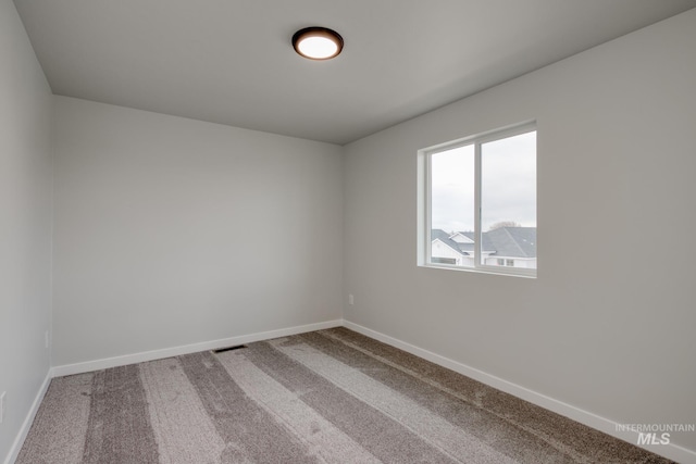 2804 N Eagle Meadow Ave, Kuna, ID 83634 - empty room featuring visible vents, baseboards, and carpet