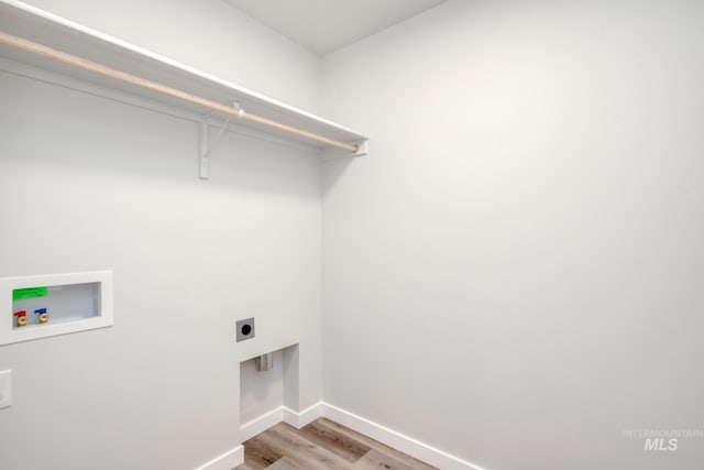 2804 N Eagle Meadow Ave, Kuna, ID 83634 - laundry room featuring baseboards, washer hookup, laundry area, light wood-style flooring, and electric dryer hookup