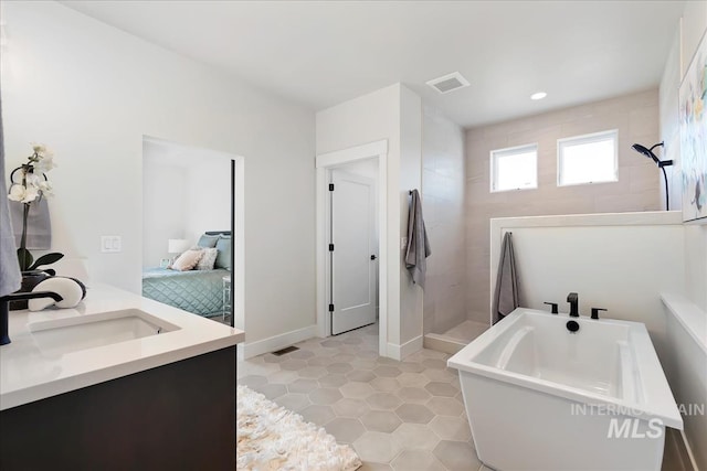 819 Cedar Point Way, Nampa, ID 83686 - full bath with walk in shower, tile patterned flooring, a freestanding bath, vanity, and ensuite bathroom