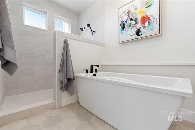 819 Cedar Point Way, Nampa, ID 83686 - full bath featuring walk in shower, tile patterned flooring, and a freestanding bath