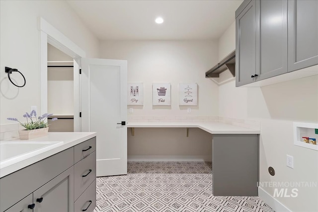 819 Cedar Point Way, Nampa, ID 83686 - clothes washing area with washer hookup, cabinet space, light flooring, a desk, and recessed lighting