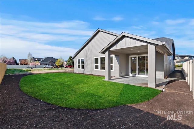 819 Cedar Point Way, Nampa, ID 83686 - rear view of house featuring a patio and board and batten siding