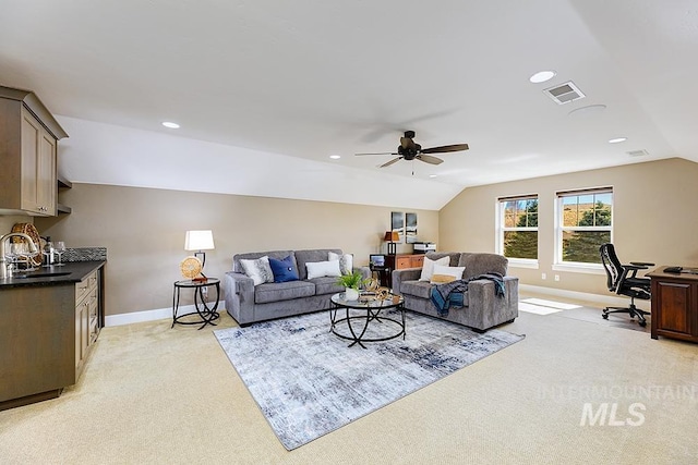 living room featuring visible vents, recessed lighting, baseboards, and lofted ceiling