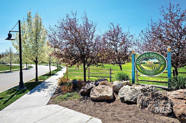 view of community featuring fence