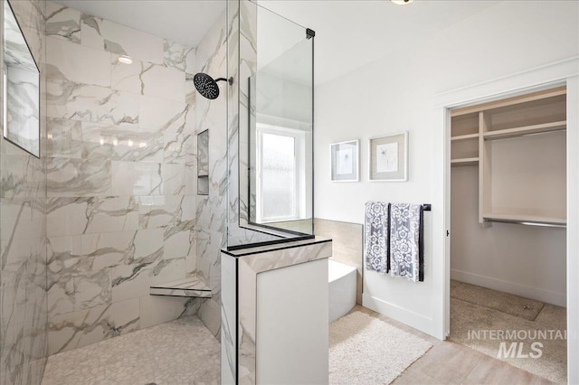 bathroom featuring tiled shower