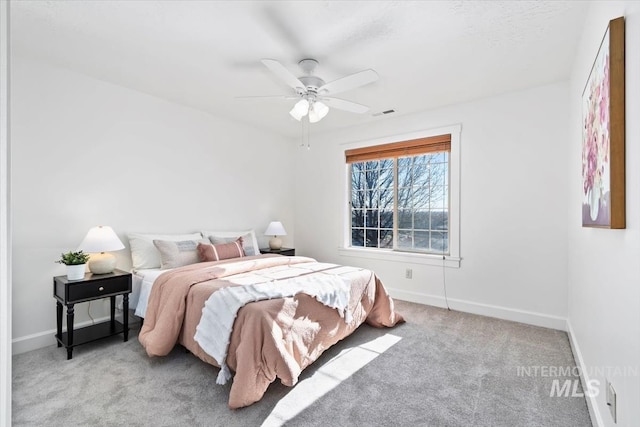 carpeted bedroom featuring ceiling fan