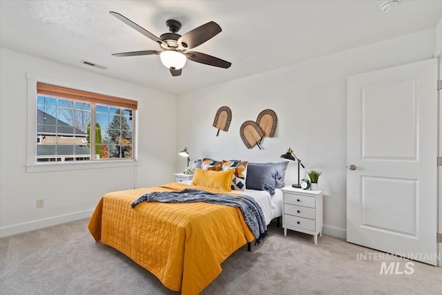 bedroom featuring ceiling fan and light colored carpet