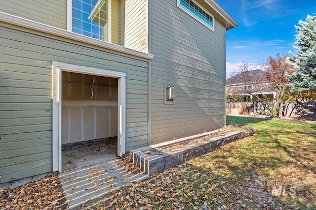 view of side of property with a yard