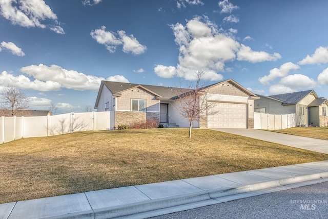 view of front of house with a garage and a front yard