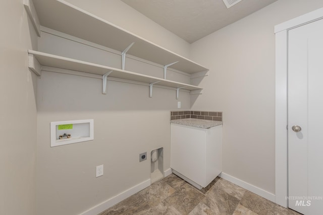 clothes washing area featuring cabinets, washer hookup, and electric dryer hookup