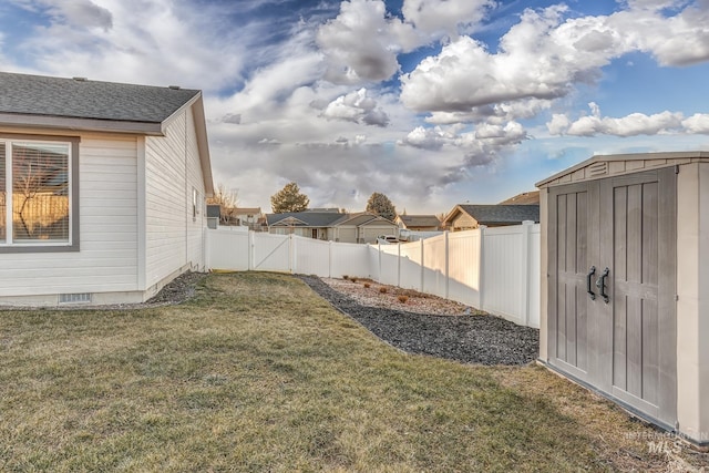 view of yard with a storage shed