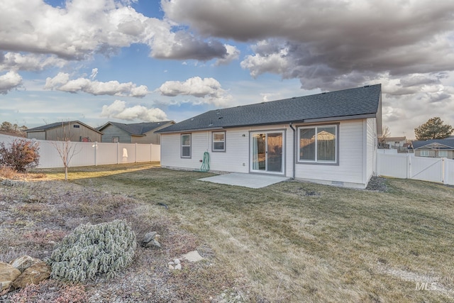 back of property featuring a yard and a patio