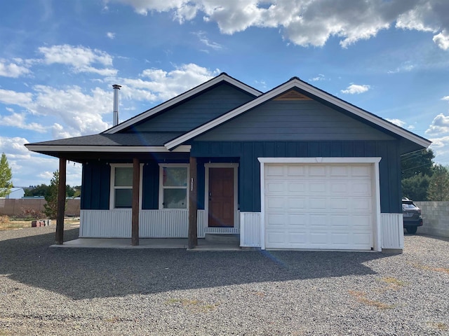 view of front of property with a garage and a porch