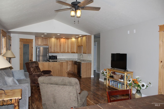 living room with sink, ceiling fan, dark hardwood / wood-style flooring, and vaulted ceiling