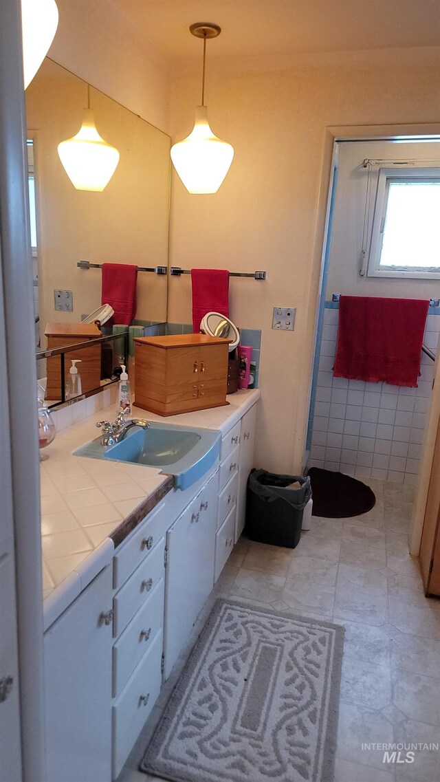 bathroom featuring vanity and tile patterned flooring