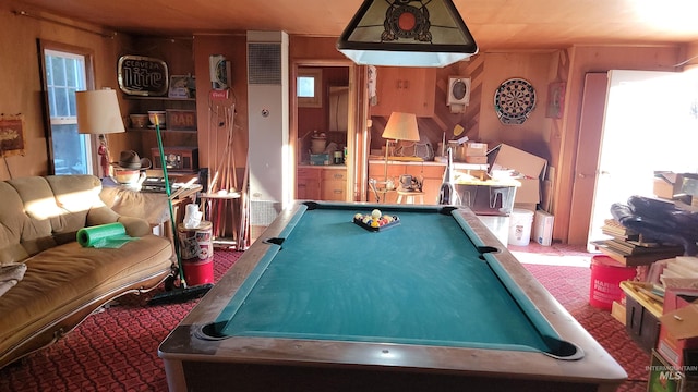 playroom with pool table and wooden walls