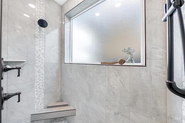 full bathroom with tiled shower