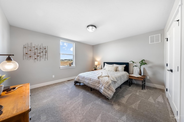 bedroom with carpet, visible vents, and baseboards