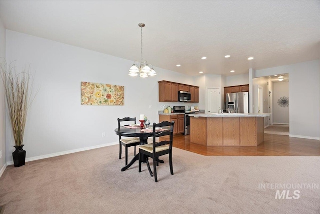 182 New Hampshire Way, Twin Falls, ID 83301 - dining room featuring light colored carpet, a chandelier, baseboards, and recessed lighting