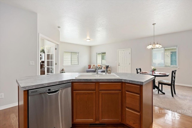 182 New Hampshire Way, Twin Falls, ID 83301 - kitchen with dishwasher, a sink, a chandelier, open floor plan, and decorative light fixtures