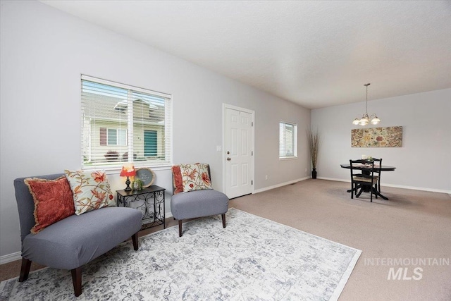 182 New Hampshire Way, Twin Falls, ID 83301 - living area featuring a chandelier, baseboards, and carpet