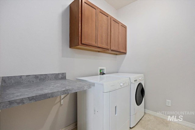 182 New Hampshire Way, Twin Falls, ID 83301 - laundry room featuring washing machine and dryer, cabinet space, baseboards, and light tile patterned floors