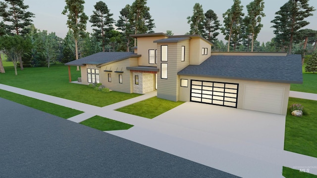 view of front of home featuring a front yard and a garage