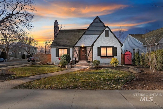 view of front of house with a yard