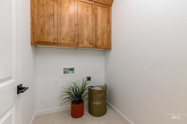 2041 W Gelding St, Middleton, ID 83644 - laundry room featuring cabinet space, electric dryer hookup, hookup for a washing machine, baseboards, and tile patterned flooring