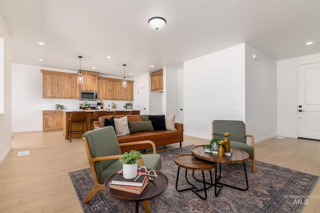 2041 W Gelding St, Middleton, ID 83644 - living area with light wood-style floors, recessed lighting, and baseboards