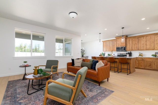 2041 W Gelding St, Middleton, ID 83644 - living room with light wood-style flooring, recessed lighting, and baseboards