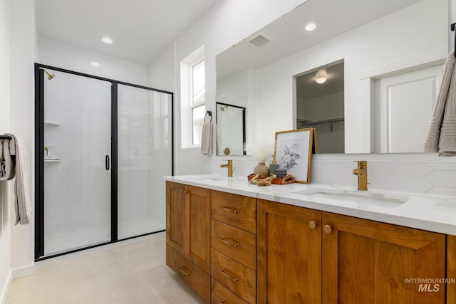 2041 W Gelding St, Middleton, ID 83644 - full bath featuring double vanity, a shower stall, decorative backsplash, recessed lighting, and a spacious closet