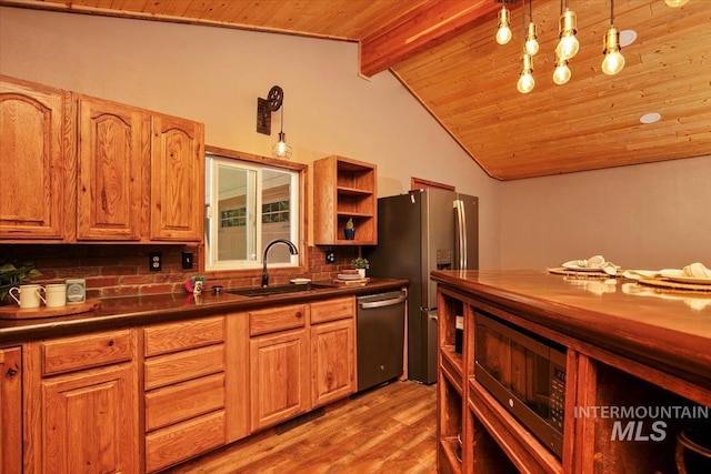 kitchen with wood ceiling, dark countertops, a sink, vaulted ceiling with beams, and stainless steel appliances