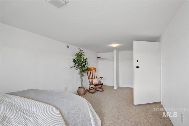 bedroom featuring visible vents and carpet