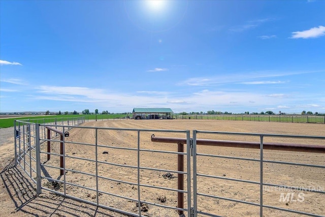 exterior space with an enclosed area and a rural view