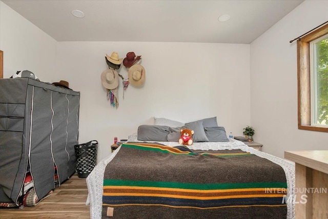 bedroom featuring wood finished floors
