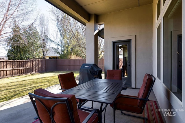 view of patio / terrace featuring fence private yard, outdoor dining area, and grilling area