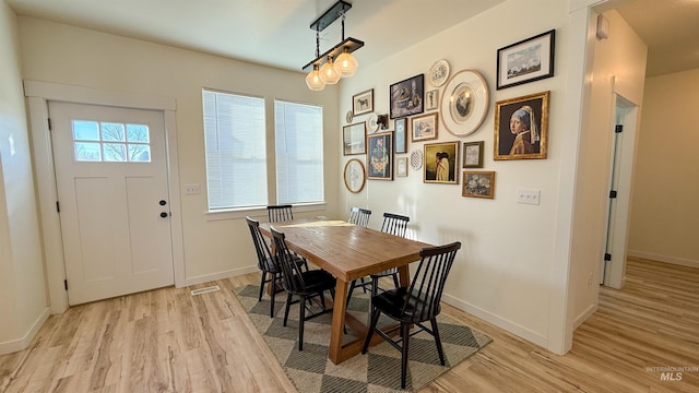 dining space featuring light hardwood / wood-style floors