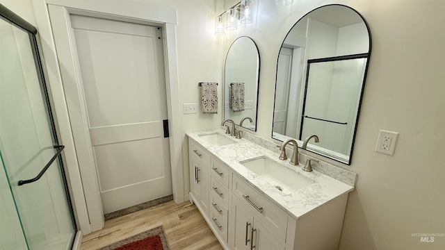 bathroom with vanity and hardwood / wood-style floors