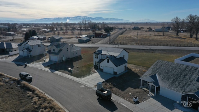 drone / aerial view featuring a mountain view