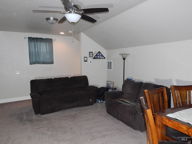 living room with ceiling fan, lofted ceiling, and carpet