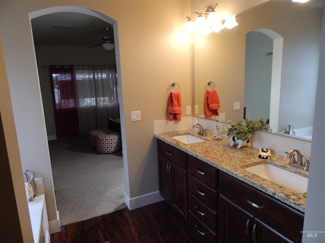 bathroom featuring vanity, hardwood / wood-style flooring, and ceiling fan